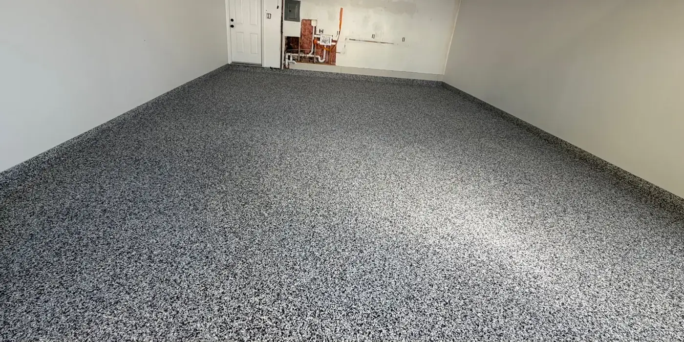 After: two-car garage floor finished by Iron Cross