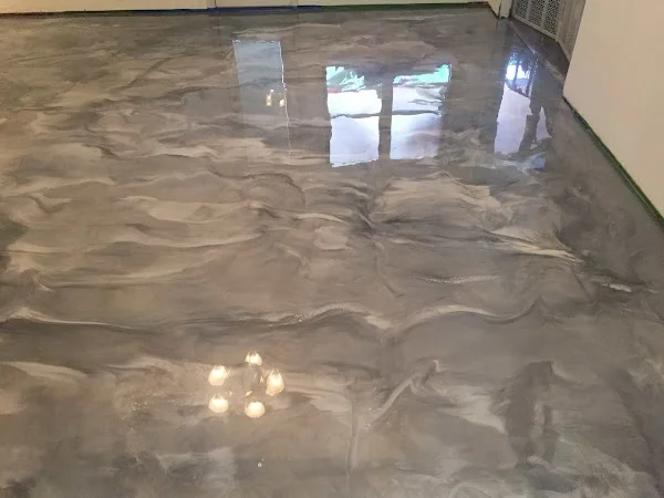 High-gloss silver and white metallic epoxy floor in an interior room