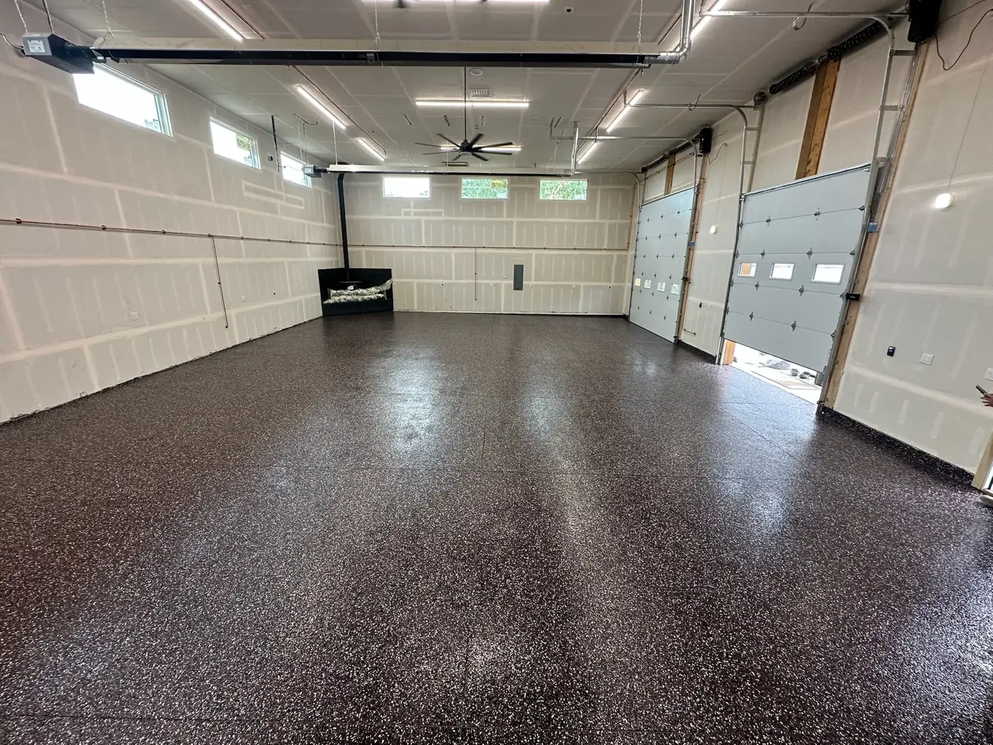 Large two-bay shop with a dark brown and black full-flake floor